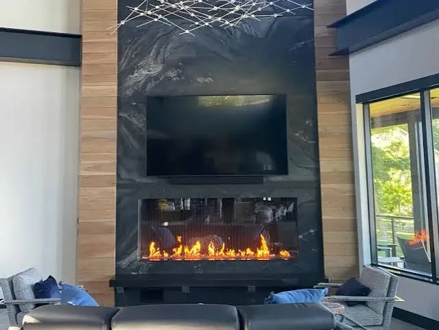 Above-fireplace TV mount with heat-safe hardware
